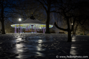 Fine art photograph of the illuminated Riverside Park Gazebo surrounded by ice and snow in Baltimore MD