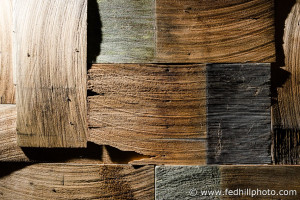 Fine art photo of an arrangement of interlocking multi-color cedar wood shake shingles.