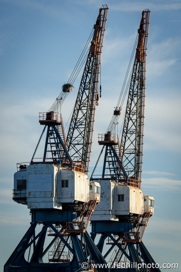 Fine art photo of industrial ship cranes in Locust Point, Baltimore, Maryland.