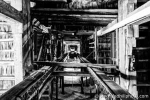 Fine art photograph looking up from floor at internal frame of Phoenix Shot Tower in Baltimore, Maryland.