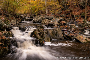 Fine art autumn nature photo of waterfall in Broad Run stream feeding into Gunpowder Falls river.