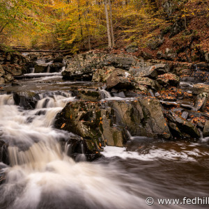 Fine art autumn nature photo of waterfall in Broad Run stream feeding into Gunpowder Falls river.