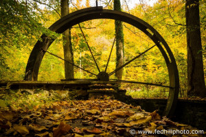 Fine art autumn photo of decay and rust on Orianda House Water wheel in Leakin Park, Baltimore City, Maryland.