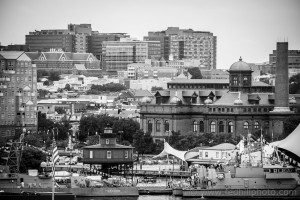 Fine art black and white photo of a lighthouse, Johns Hopkins, MECU Pavilion, and other buildings in Baltimore City, Maryland.