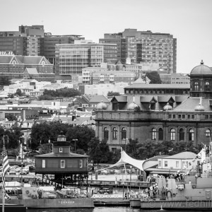 Fine art black and white photo of a lighthouse, Johns Hopkins, MECU Pavilion, and other buildings in Baltimore City, Maryland.