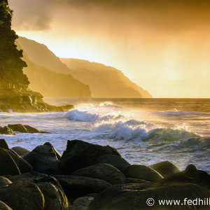 Fine art photograph of sunset over Pacific Ocean surf, water, and waves at Napali Coast Ke'e beach and cliffs, Kauai, Hawaii.