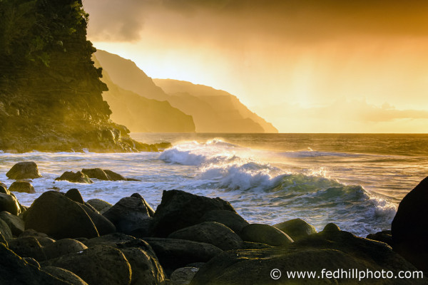 Fine art photograph of sunset over Pacific Ocean surf, water, and waves at Napali Coast Ke'e beach and cliffs, Kauai, Hawaii.