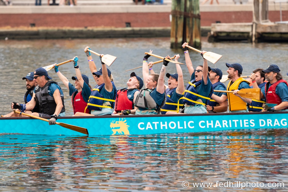 Non profit event photo of people competing in a dragon boat race.